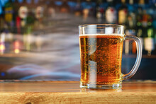 Fresh Cold Beer In Glass On Bar Background