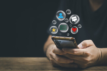 Wall Mural - Social media technology concept, man hand using smartphone Login to the online network Use social media to do business and marketing payment from home through the Internet.