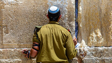 An Israeli Soldier Prays At The Western Wall