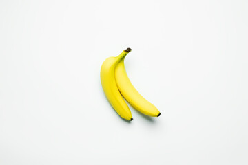 Canvas Print - Top view of fresh bananas on white background.