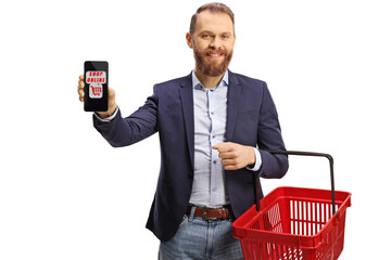 Wall Mural - Young man showing a mobile phone with text shop online and holding a shopping basket