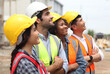 © sittinan - Diverse Team of Specialists engineering on Construction Site. Real Estate Building Project with Civil Engineer, Architect, Business Investor and General Worker Discussing Plan Details.