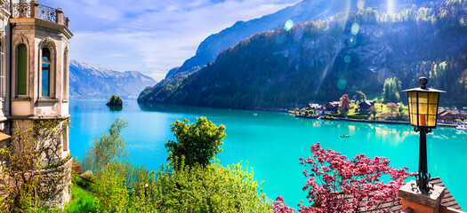 Canvas Print - Stunning idylic nature scenery of lake Brienz with turquoise waters. Switzerland, Bern canton. Iseltwald village surrounded turquoise waters