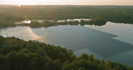 Wall Mural - Aerial view of group photovoltaic panels floating on open water in pond