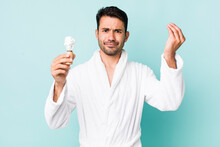 Young Adult Hispanic Man Making Capice Or Money Gesture, Telling You To Pay. Shaving Concept