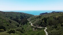 Scenic Tamalpais Valley Mountains And Curvy  Shoreline Highway With Muir Beach In The Background