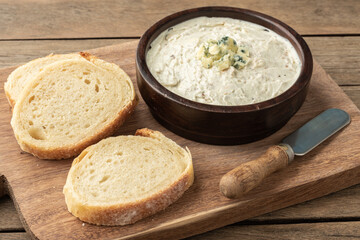 Gorgonzola cheese dip with sliced bread. Blue cheese cream