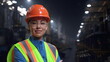 Woman engineer smiling camera wearing safety helmet at huge industrial storage.