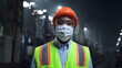 © stockbusters - Mechanic wearing face mask looking camera at manufacturing company factory.