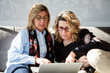 Senior ladies working on laptop together.