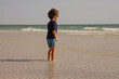 © Tamara Sales  - boy playing on Sunset Beach  located at the southern tip of Treasure Island, Florida in Pinellas County.