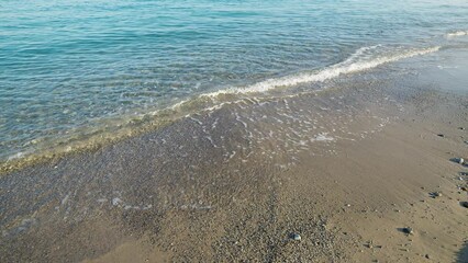 Wall Mural - Beach with sea and calm waves in Summer in Sicily.