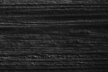 Black old wood background. Dark background from the texture of an old wooden board