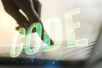 Poster - Creative Code word hologram and hands typing on computer keyboard on background, artificial intelligence and neural networks concept. Multiexposure