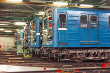 Blue Locomotives Head Cars Of Electric Subway Cars In The Depot Stand In A Row.