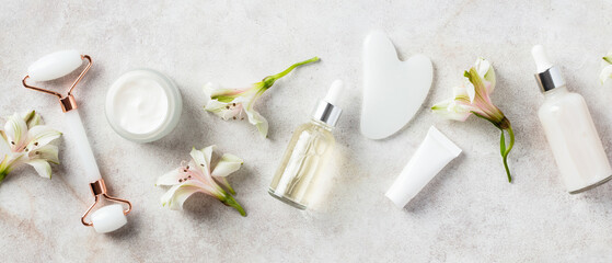 Wall Mural - banner with natural organic facial cosmetics. white jade face roller, gua sha, moisturizer cream, se