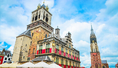 Nieuwe Kerk tower and Town hall on Market square of old beautiful city Delft, Netherlands