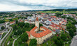 Drone view of the Altstadt Freistadt square. Old church, clock tower on the square in Austria, Tyrol