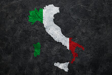 Painted Map Of Italy In Colors Of National Flag On Dark Grunge Background