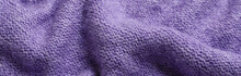 Texture Of Purple Knitted Fabric As Background. Banner For Design