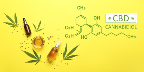 Bottles and bowl of CBD oil on yellow background