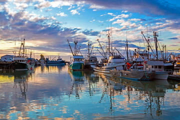  
Fishing Boats in Marina and a cloudy sky. This marina is located in the Steveston area of Richmond. The fishing village formed in this place was the first settlement on the territory of  Richmond 
