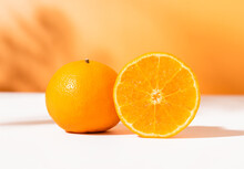Close Up Of Orange Fruits With Slices On White Background, For Placing Products For Advertising.