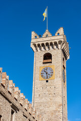 Sticker - Close-up of the medieval town hall tower (Torre Civica or Torre di Piazza), XI century, in Trento Downtown, Trentino-Alto Adige, Italy, Europe. Town square called Piazza Duomo (Cathedral square).