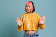 canvas print picture Asian girl with pink hair and piercing showing stop gesture at camera