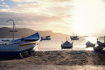 Wall Mural - Photographs of beaches of Margarita Nueva Esparta in the morning and at sunset. You can see mountains, sun, clouds, sun rays, sunset, beaches, ships, boats, people fishing, rocks, waves, mist,