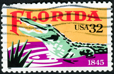 Wall Mural - USA - CIRCA 1995: Postage stamp shows a crocodile and inscription Florida