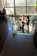 © Wavebreak Media - African american mid adult business people discussing with albino male colleague on steps