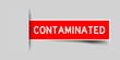 Inserted red color label sticker with word contaminated on gray background