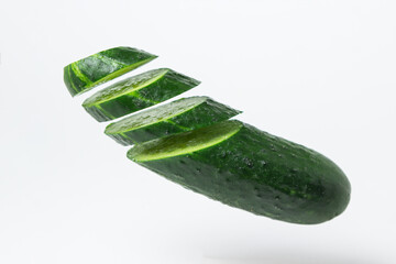 Wall Mural - Sliced cucumber isolated on white background. Fresh juicy cucumber