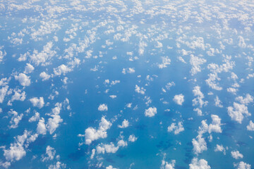 Wall Mural - view from the airplane window, clouds and blue sky,
