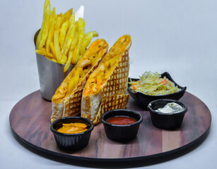 French tacos with french fries with ketchup and mayonnaise. isolated on a white background