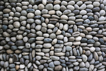 Wall Mural - Pebble stone wall texture background . Exterior concept