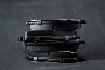 car brake pads on a black background