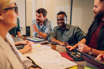 Multiracial business team working together and having a meeting in the office