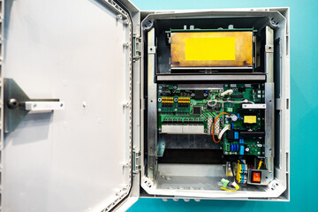 Poster - electrical equipment for automation. metal cabinet with boards and wires. block with boards and micr
