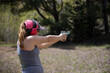© Daniel Teetor - Woman shooting a handgun.