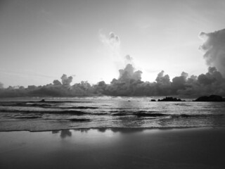 Wall Mural - fluffy clouds at the ocean