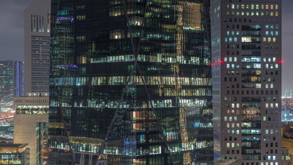 Wall Mural - Windows of office buildings at night timelapse, the light from the windows of houses