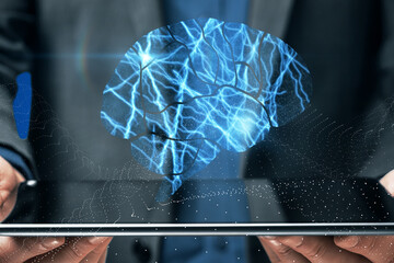 Aufkleber - Close up of businessman hands holding tablet with abstract shiny blue digital brain hologram on dark background. Human technology, research and science concept.