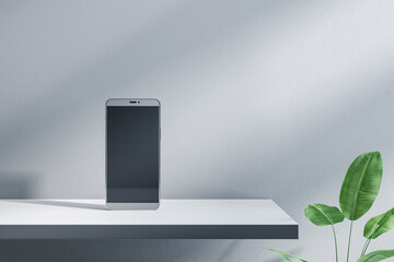 Poster - Close up of empty smartphone screen on designer office desktop. Decorative plant and concrete wall background. Mock up, advertisement, technology, product review and webinar concept. 3D Rendering.