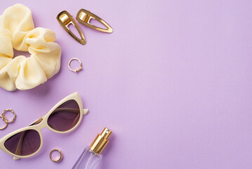 Wall Mural - Makeup beauty concept. Top view photo of trendy sunglasses scrunchy perfume bottle gold rings and barrettes on isolated pastel violet background with copyspace