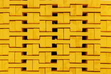 New Yellow Wooden Formwork Stacked In A Warehouse In Large Stack. Materials For The Construction And Erection Of Concrete Structures. Wooden Formwork Made Of Plywood.