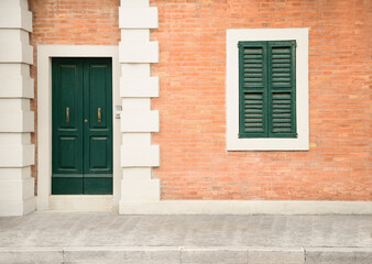 Beautiful building with wooden door on city street