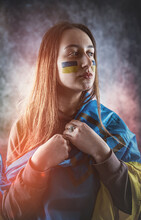 Woman Wrapped In A Ukrainian Flag Cries Over The War Started By Russia.