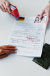 © AnnaStills - High angle medium close-up of woman having appointment in embassy getting application for visitor visa rejected